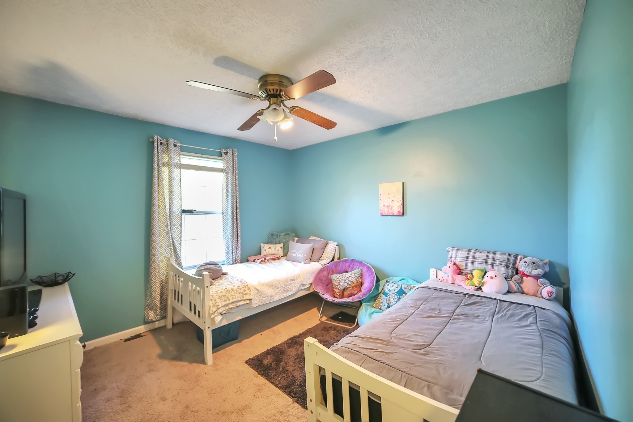 806 Old Gallatin Road Portland, TN 37148 - Photo 11 of 16 a bedroom with a bed and a chandelier