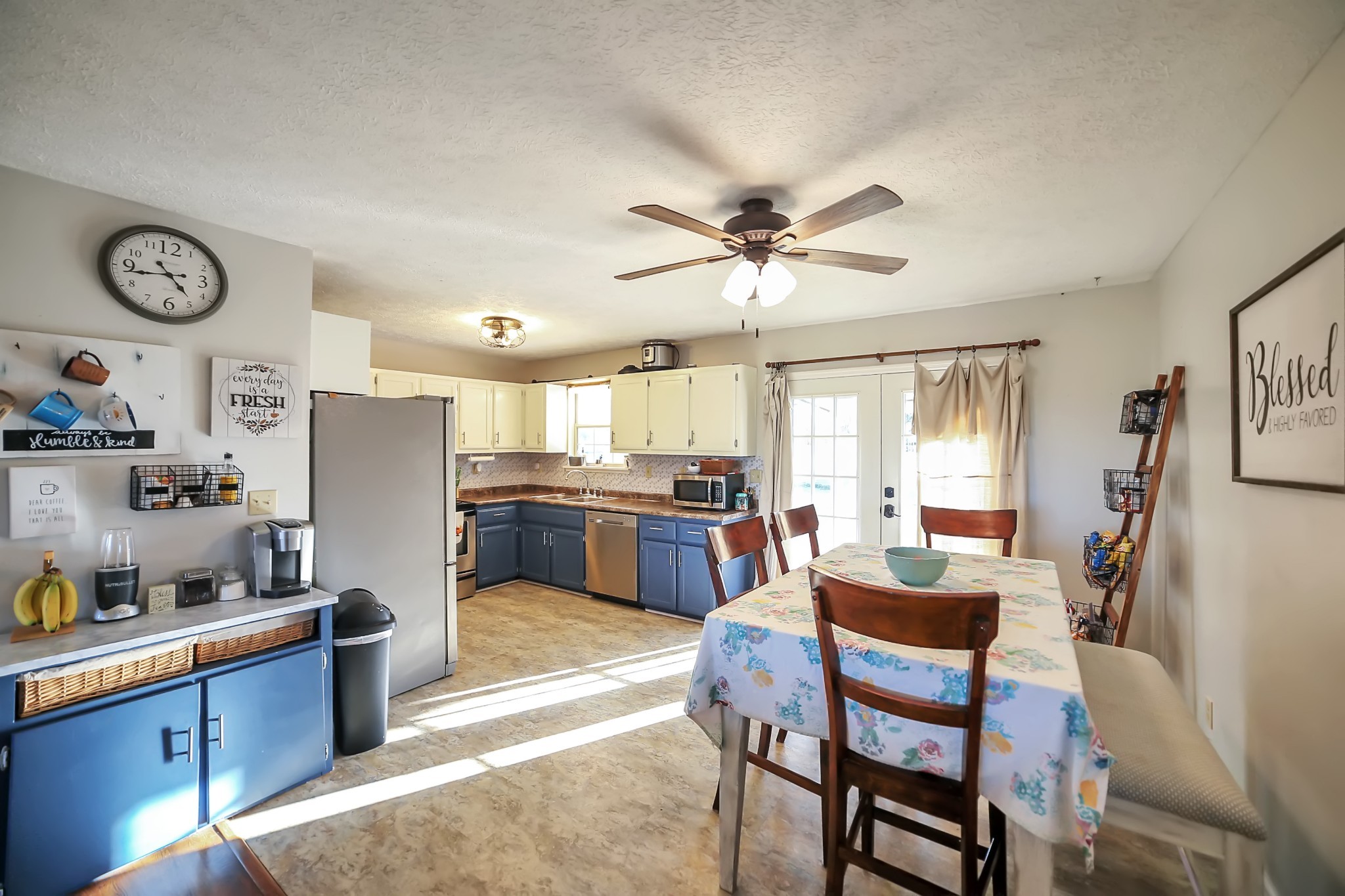 806 Old Gallatin Road Portland, TN 37148 - Photo 5 of 16 a living room with stainless steel appliances kitchen island granite countertop furniture and a large window