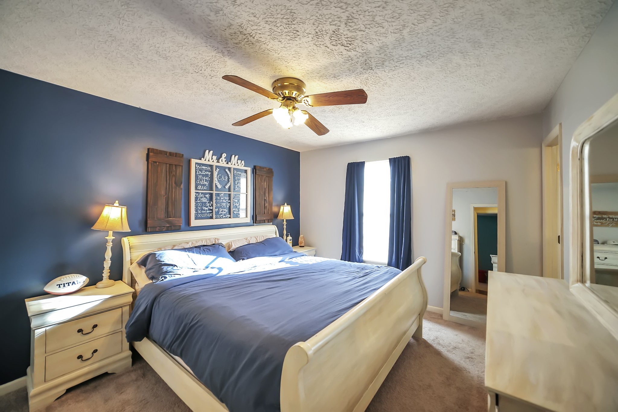 806 Old Gallatin Road Portland, TN 37148 - Photo 9 of 16 a bed room with a bed and a chandelier