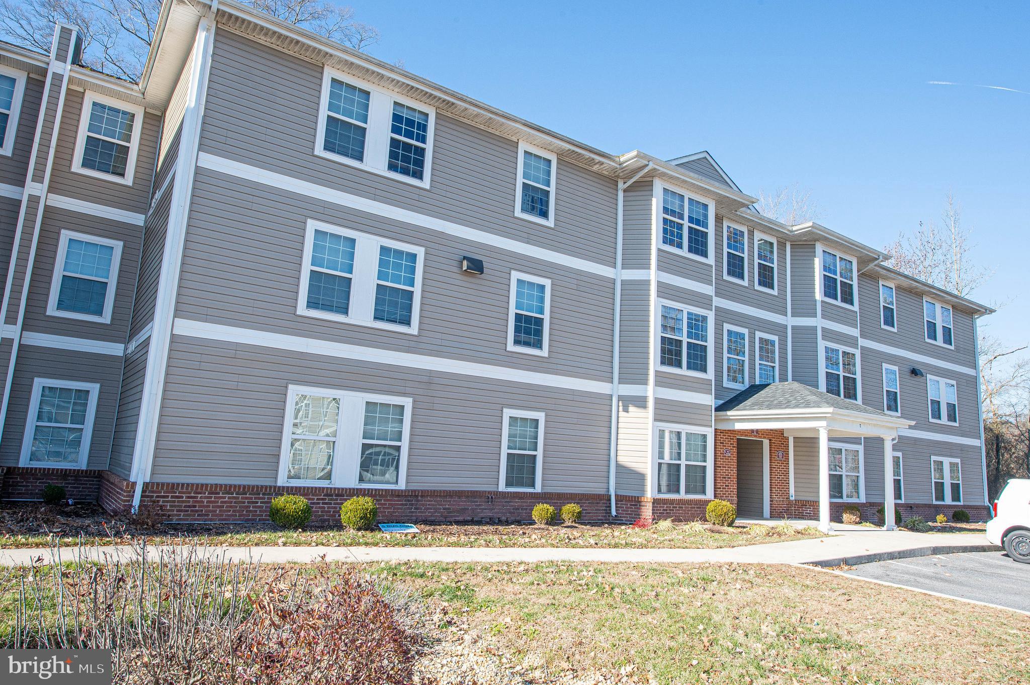 30630 Umes Boulevard, Unit V204 Princess Anne, MD 21853 - Photo 1 of 36 a front view of a building with lot of windows