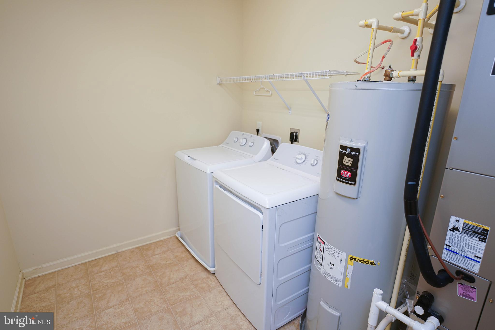 30630 Umes Boulevard, Unit V204 Princess Anne, MD 21853 - Photo 13 of 36 a utility room with dryer and washer
