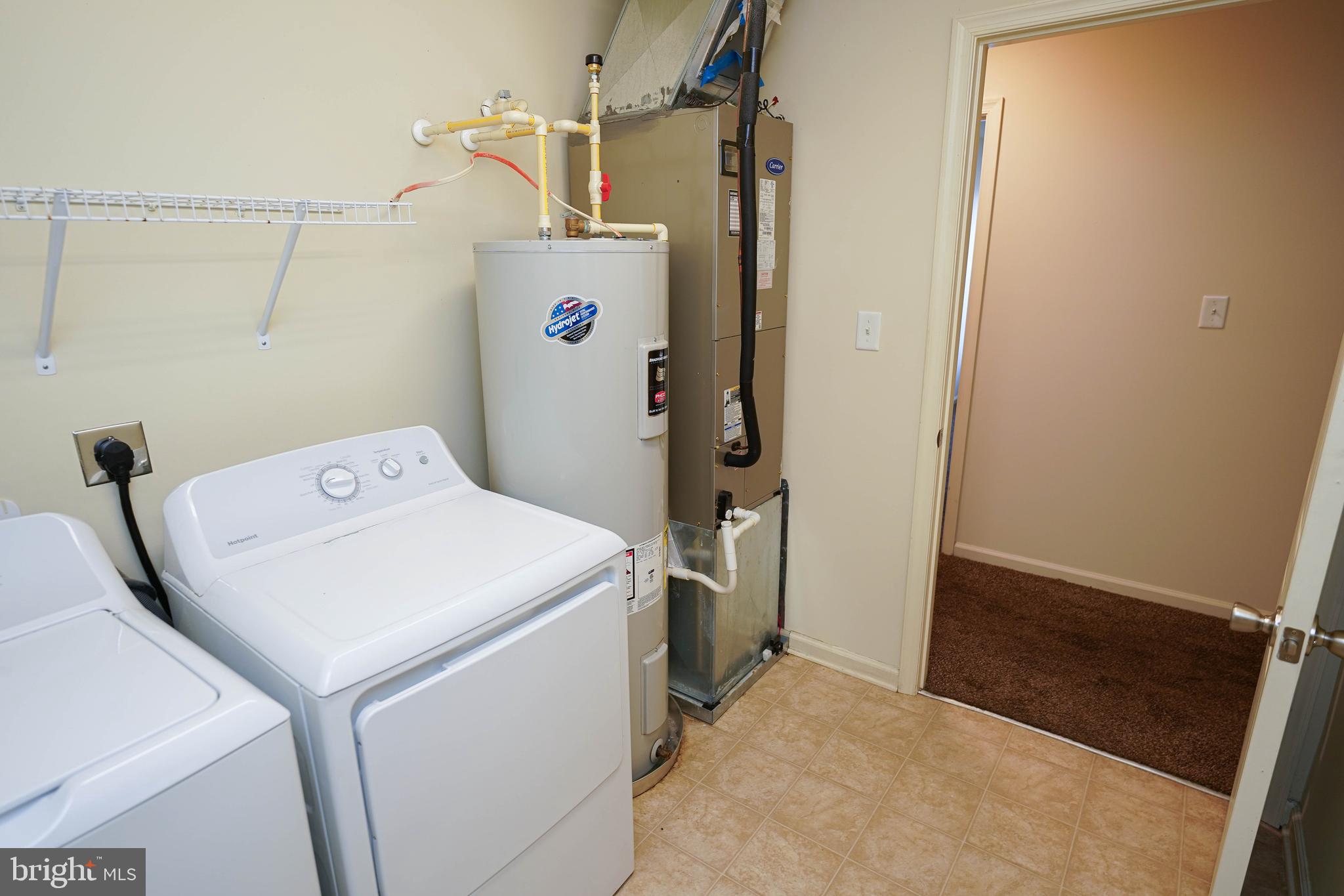 30630 Umes Boulevard, Unit V204 Princess Anne, MD 21853 - Photo 14 of 36 a utility room with dryer and washer