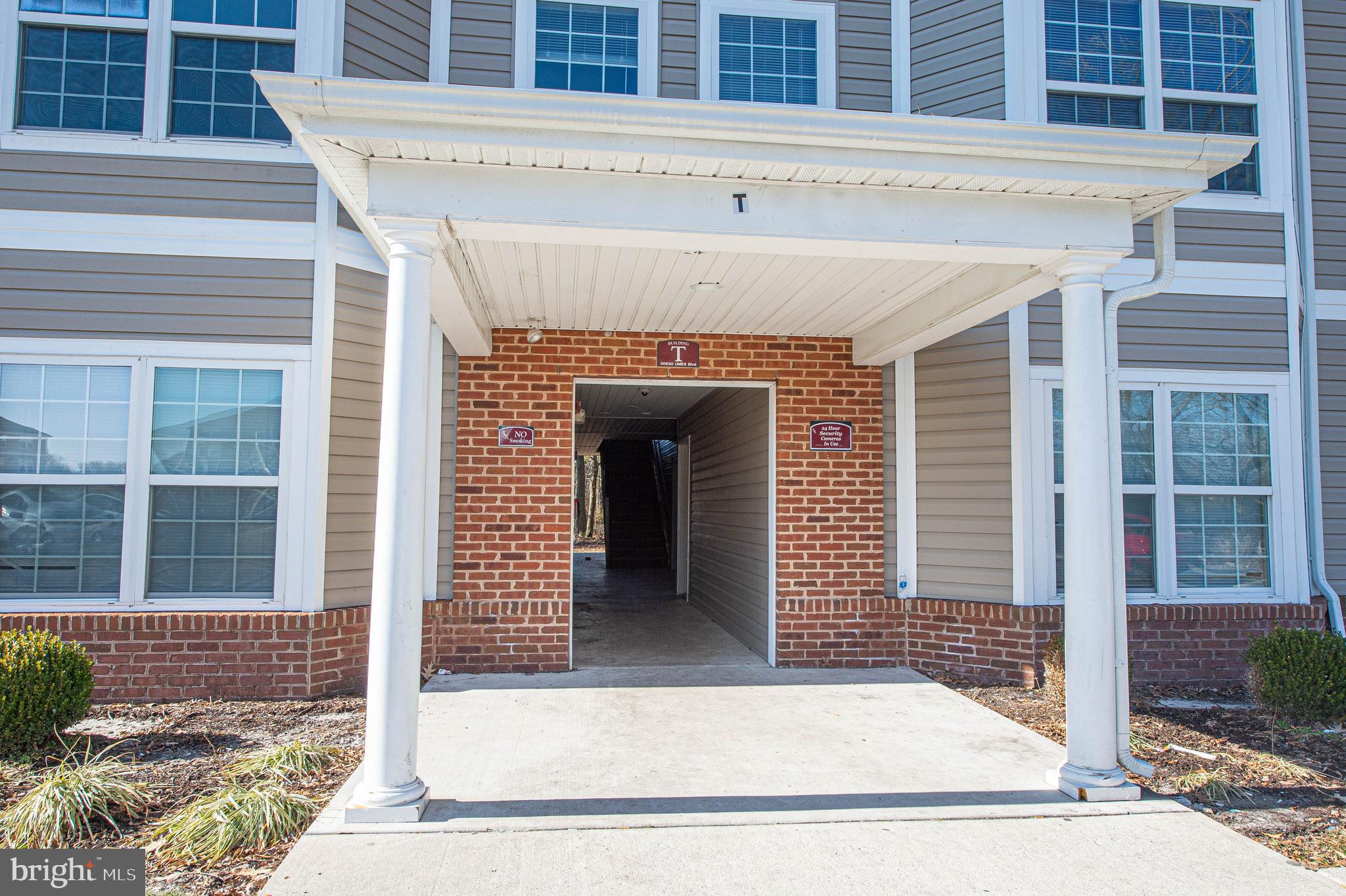 30630 Umes Boulevard, Unit V204 Princess Anne, MD 21853 - Photo 2 of 36 a front view of a house