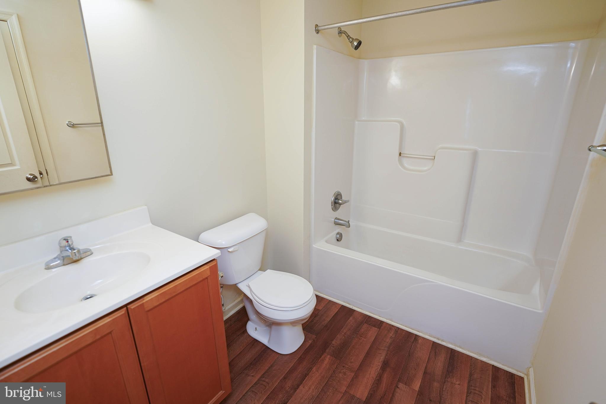 30630 Umes Boulevard, Unit V204 Princess Anne, MD 21853 - Photo 26 of 36 a bathroom with a sink toilet and shower