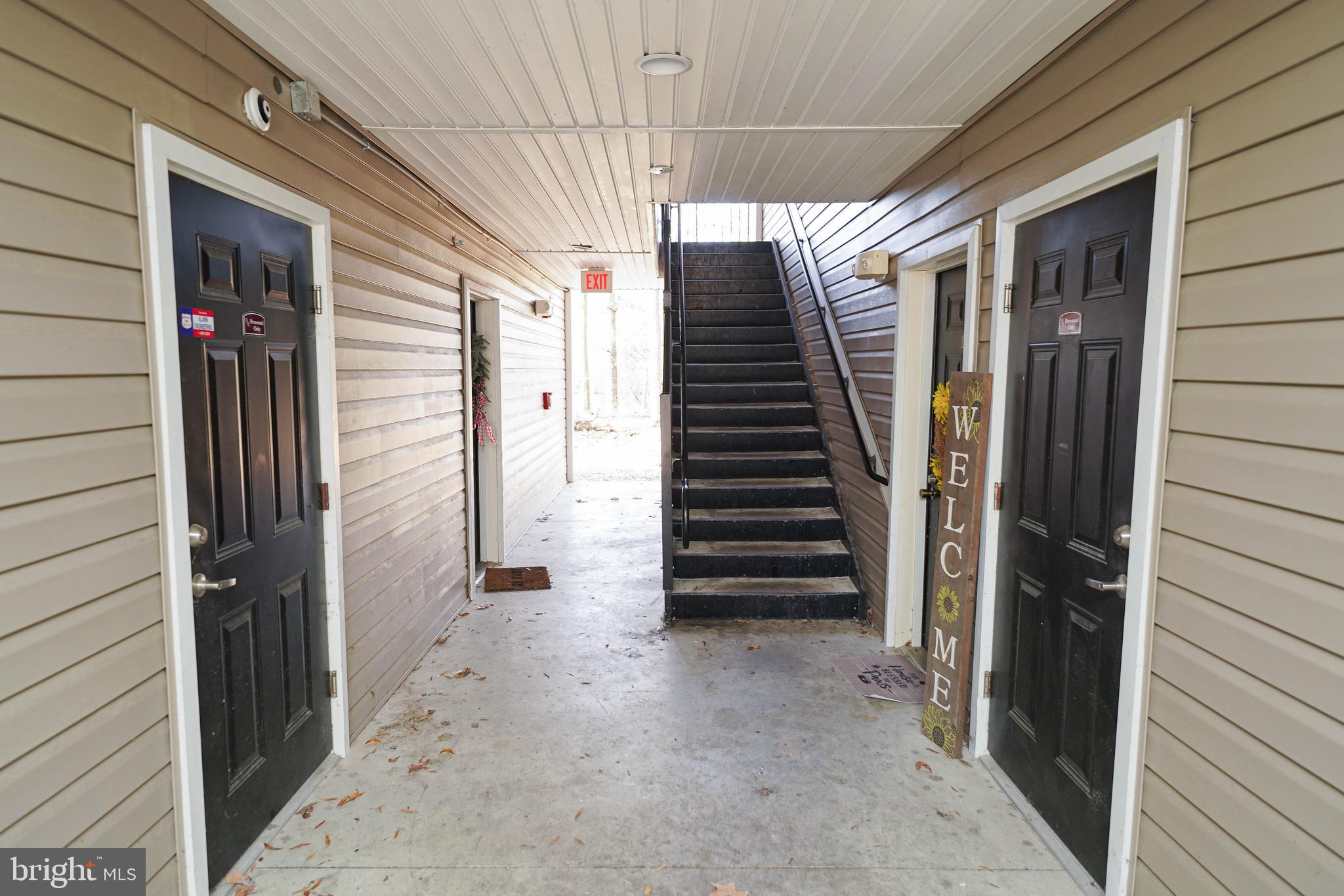 30630 Umes Boulevard, Unit V204 Princess Anne, MD 21853 - Photo 3 of 36 a view of a house with a staircase