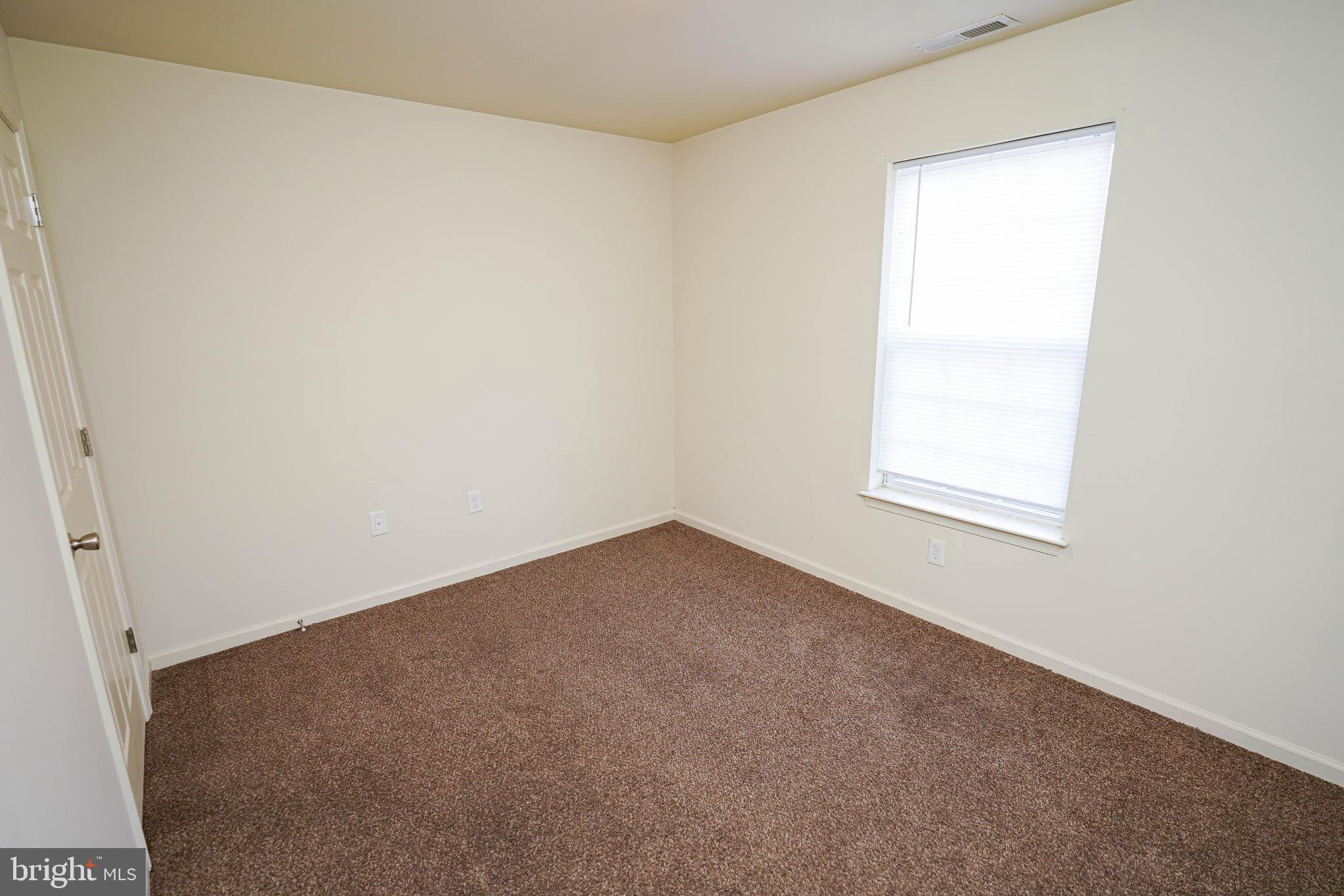30630 Umes Boulevard, Unit V204 Princess Anne, MD 21853 - Photo 33 of 36 an empty room with a window