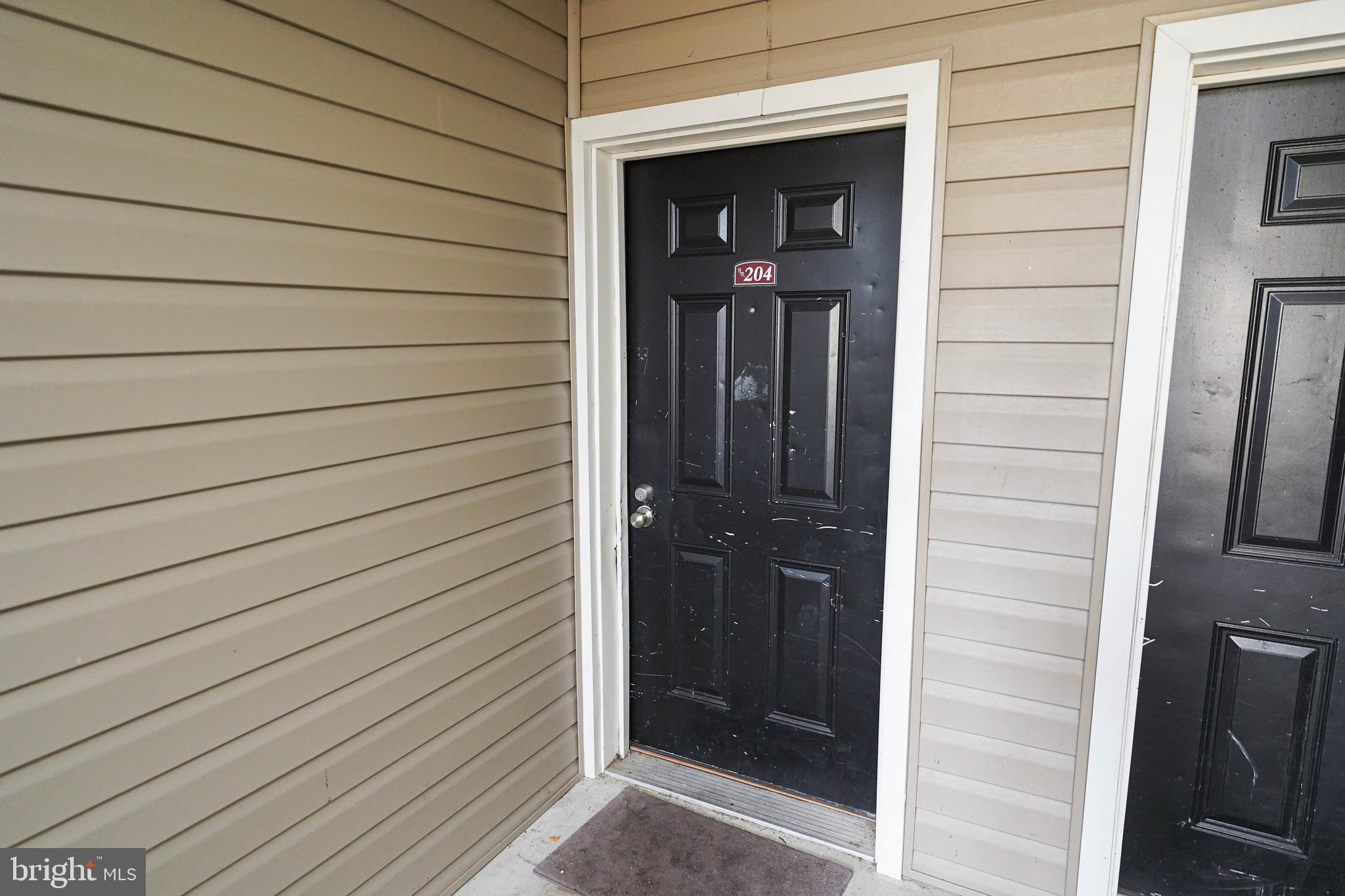 30630 Umes Boulevard, Unit V204 Princess Anne, MD 21853 - Photo 4 of 36 a view of wooden door