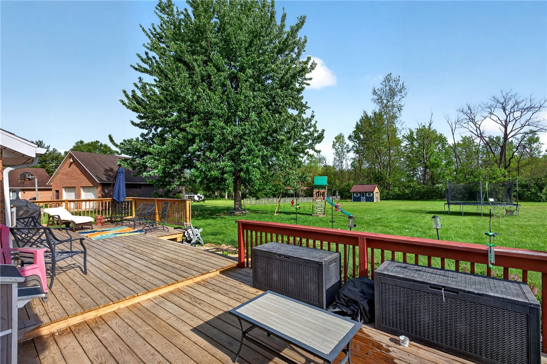 4996 Shannon Avenue Springfield, OH 45504 - Photo 52 of 61 This spacious backyard features a wooden deck, perfect for outdoor living and recreation.