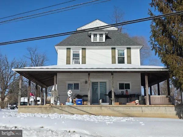 a view of a house with outdoor space and porch