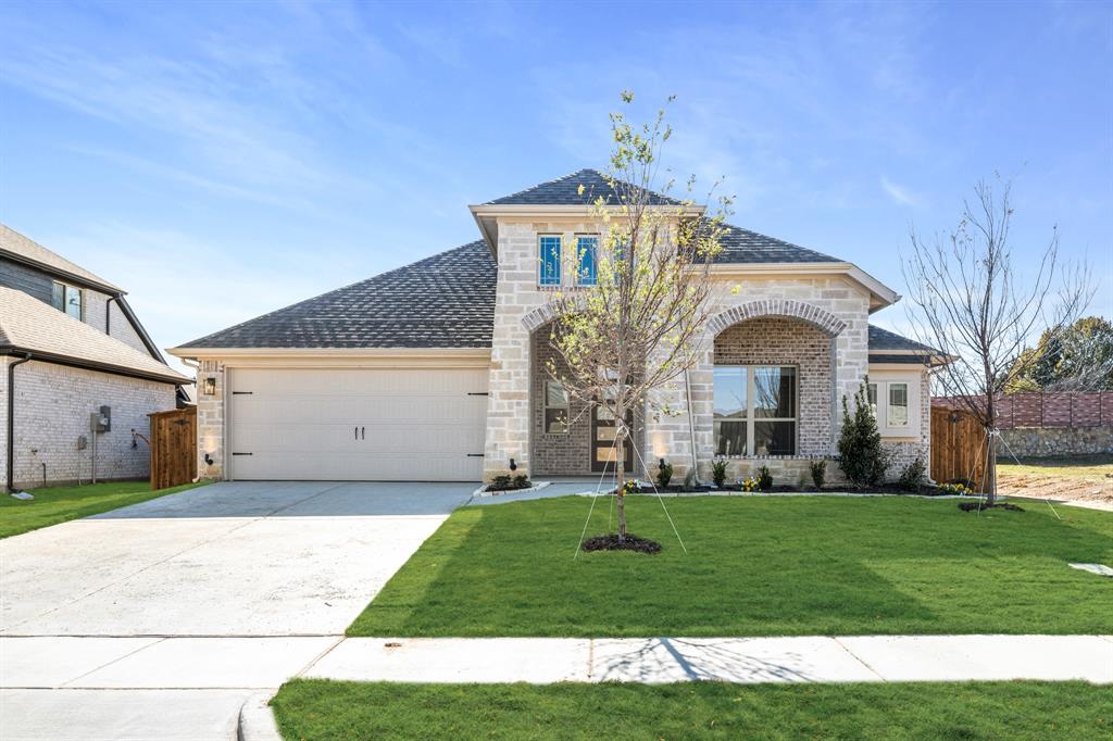733 Seahawk Street Joshua, TX 76058 - Photo 1 of 35 a front view of a house with a yard