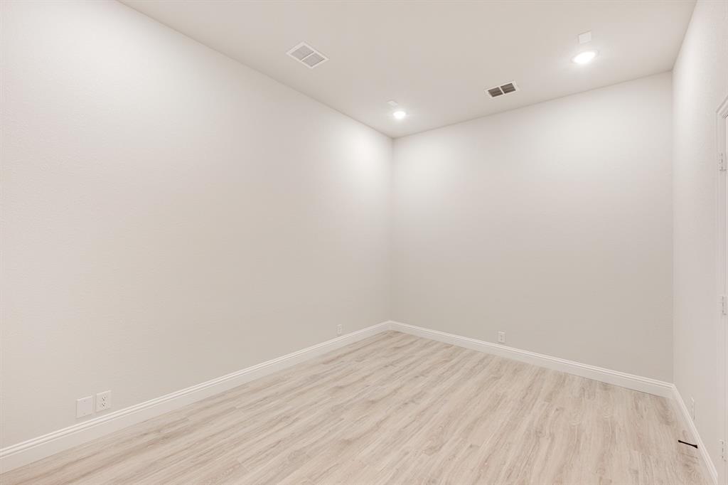 733 Seahawk Street Joshua, TX 76058 - Photo 11 of 35 a view of room with wooden floor and fan