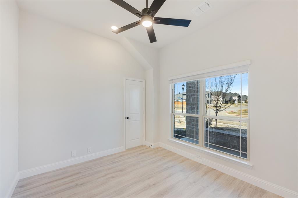 733 Seahawk Street Joshua, TX 76058 - Photo 6 of 35 a view of an empty room with a window