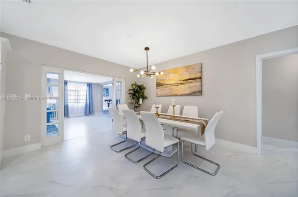 a view of a dining room with furniture