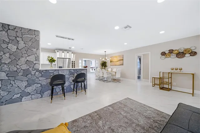 a living room with furniture and a couch