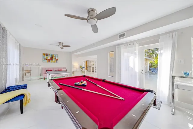 a room with gym equipment and windows