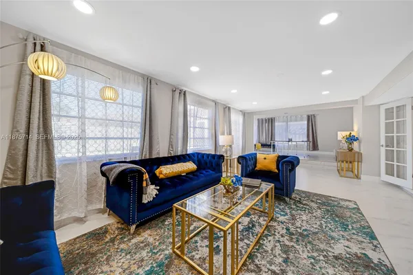 a living room with furniture and a window