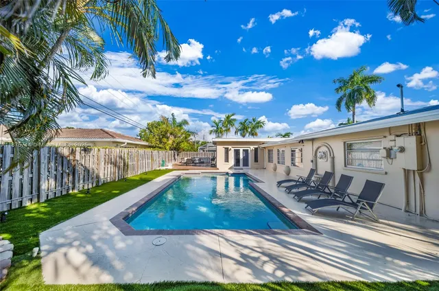 a view of a swimming pool with a patio