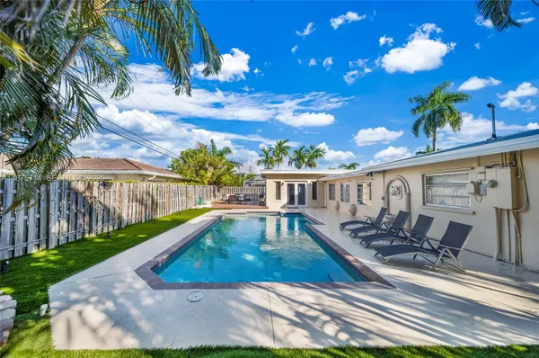 a view of a swimming pool with a patio