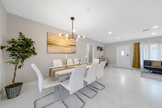 a view of a livingroom with furniture and a chandelier