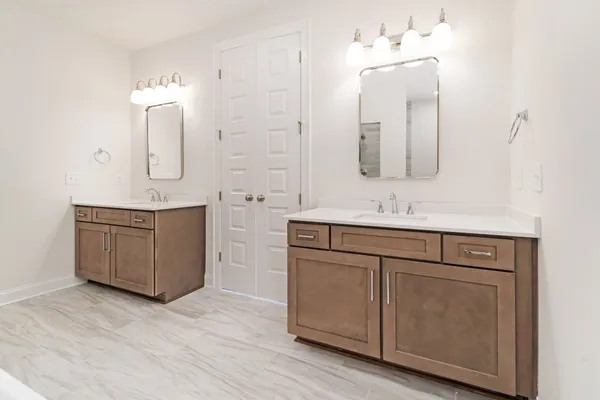 a bathroom with a sink vanity and mirror