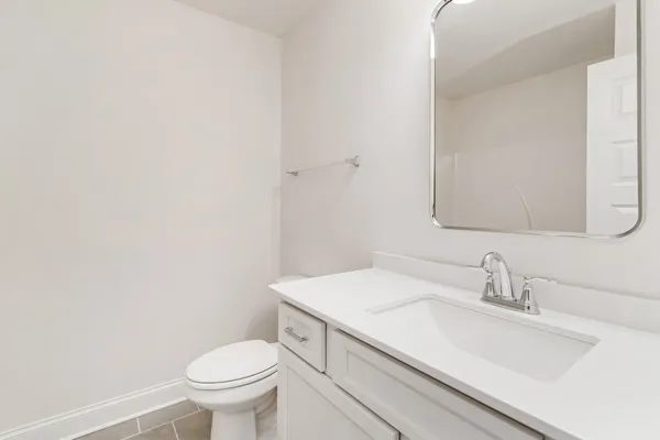 a bathroom with a sink toilet and vanity