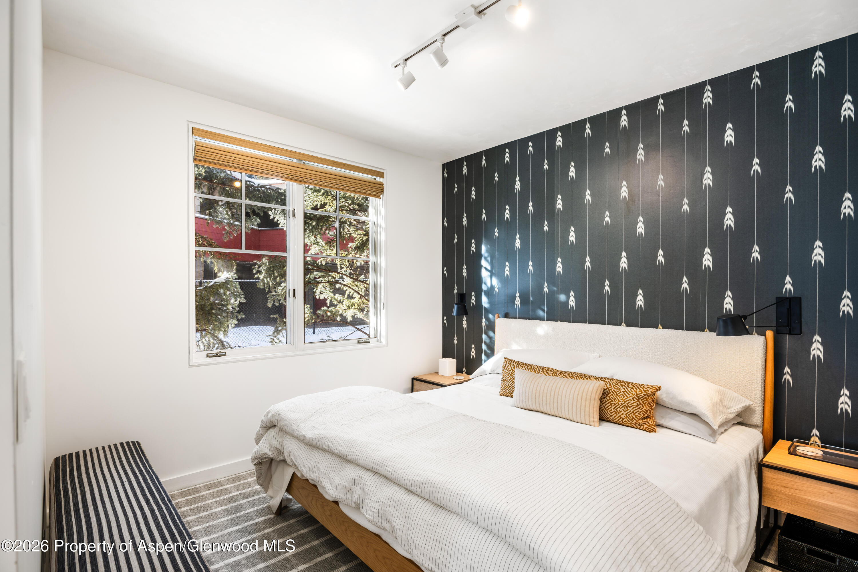 501 West Main Street, Unit A101 Aspen, CO 81611 - Photo 6 of 8 a bedroom with a bed and window