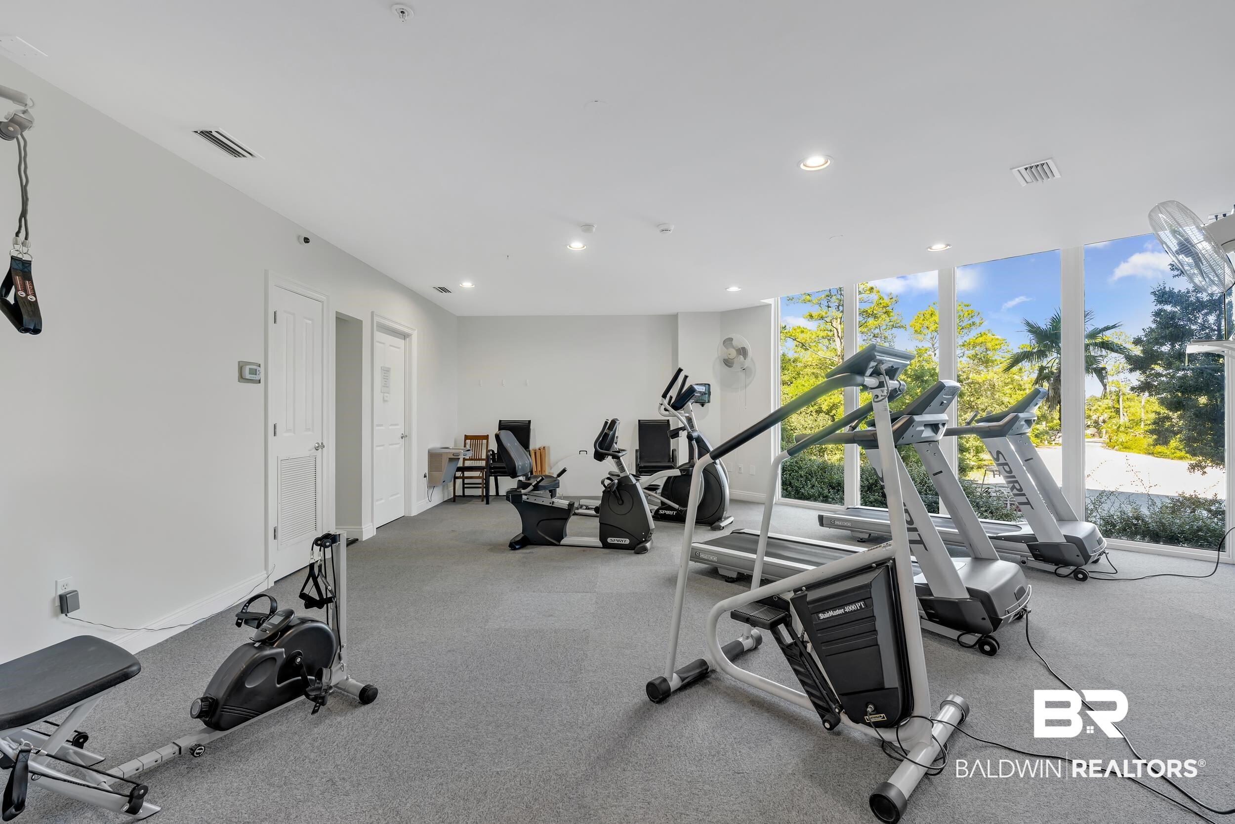 28250 Canal Road, Unit 307 Orange Beach, AL 36561 - Photo 46 of 56 Workout area with floor to ceiling windows and recessed lighting