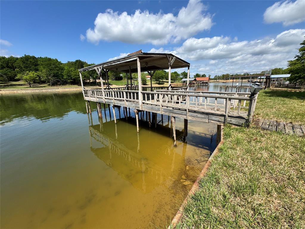 3909 Smothers Road Caney City, TX 75148 - Photo 34 of 35 a view of a swimming pool with a lake view