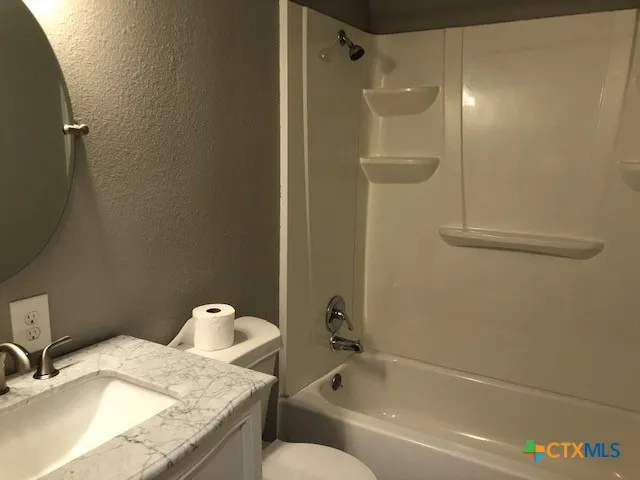 a room with a window and wooden floor