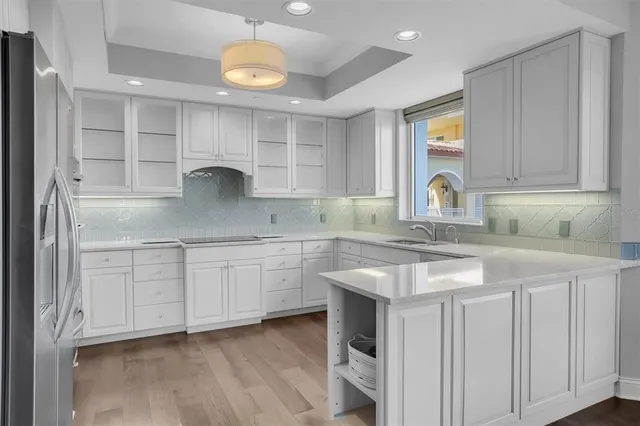 a kitchen with cabinets and stainless steel appliances