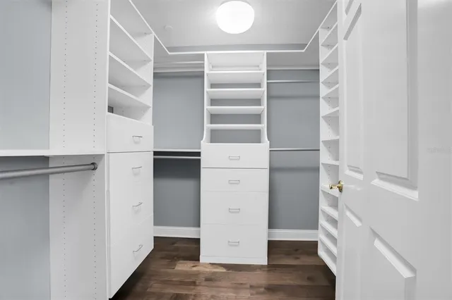 a view of hallway with wooden floor