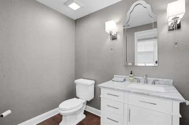 a bedroom with two beds and a chandelier