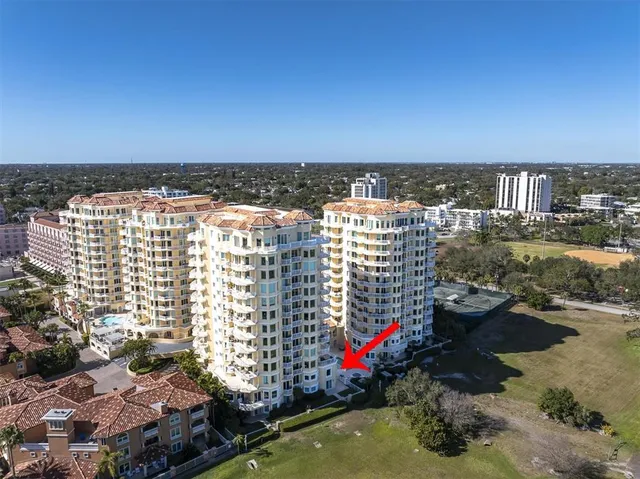 an aerial view of a house with a lake view