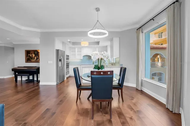 a kitchen with cabinets appliances a sink and a window