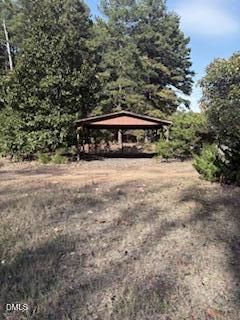 3350 Tungsten Mine Road Bullock, NC 27507 - Photo 2 of 4 a view of backyard with large trees