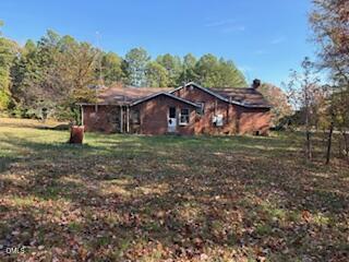 3350 Tungsten Mine Road Bullock, NC 27507 - Photo 3 of 4 a view of a house with a yard