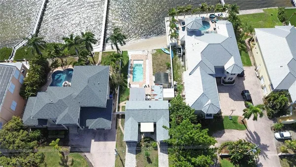 an aerial view of multiple houses with outdoor space