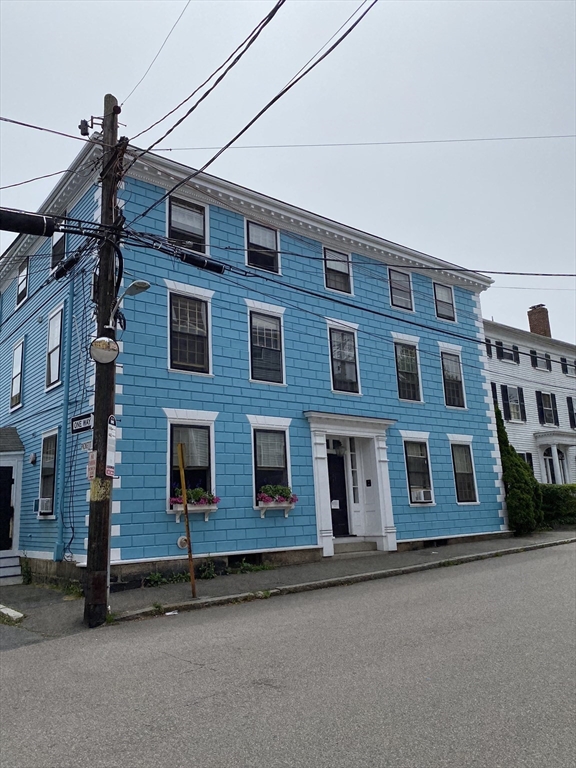 52 Washington Street, Unit 9 Marblehead, MA 01945 - Photo 1 of 17 a front view of a building with a road