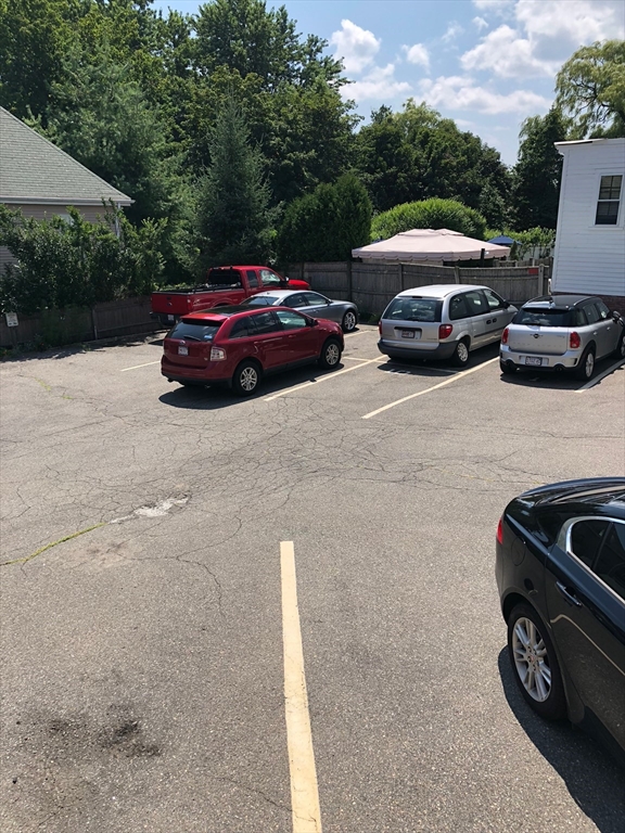52 Washington Street, Unit 9 Marblehead, MA 01945 - Photo 17 of 17 a front view of a house with parking space