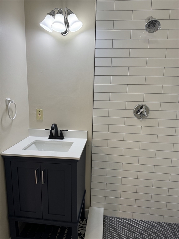 52 Washington Street, Unit 9 Marblehead, MA 01945 - Photo 7 of 17 a bathroom with a sink a vanity and a shower