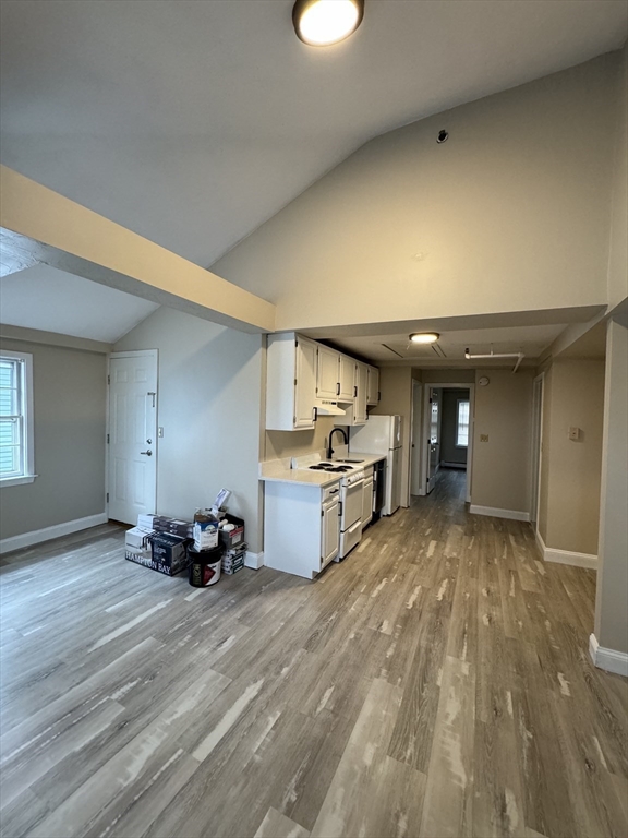 52 Washington Street, Unit 9 Marblehead, MA 01945 - Photo 8 of 17 a view of kitchen with furniture and wooden floor