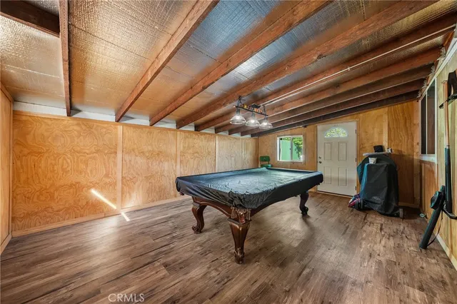 a room with furniture and wooden floor