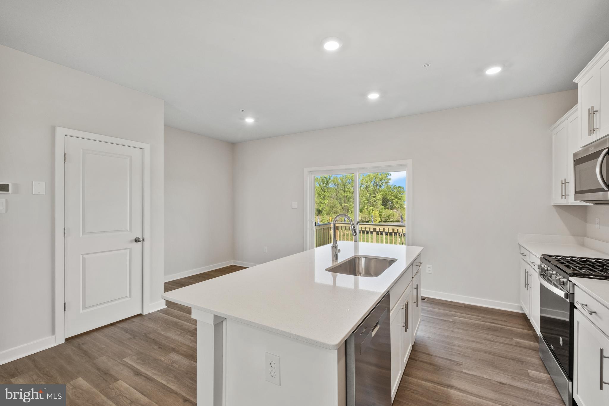 7507 Silver Thread Way Brandywine, MD 20613 - Photo 11 of 27 a kitchen with a sink and wooden floor