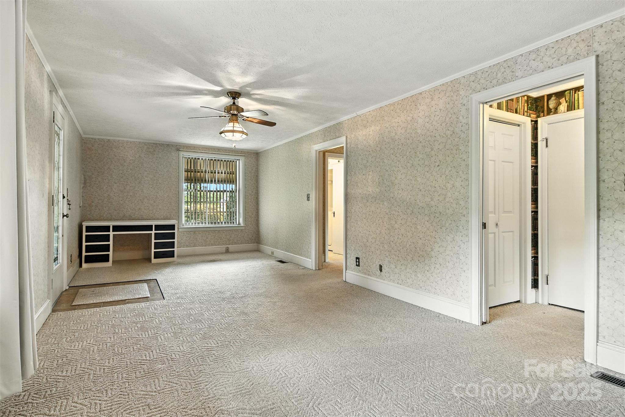 3968 Highway 321 Hudson, NC 28638 - Photo 23 of 47 an empty room with windows and ceiling fan