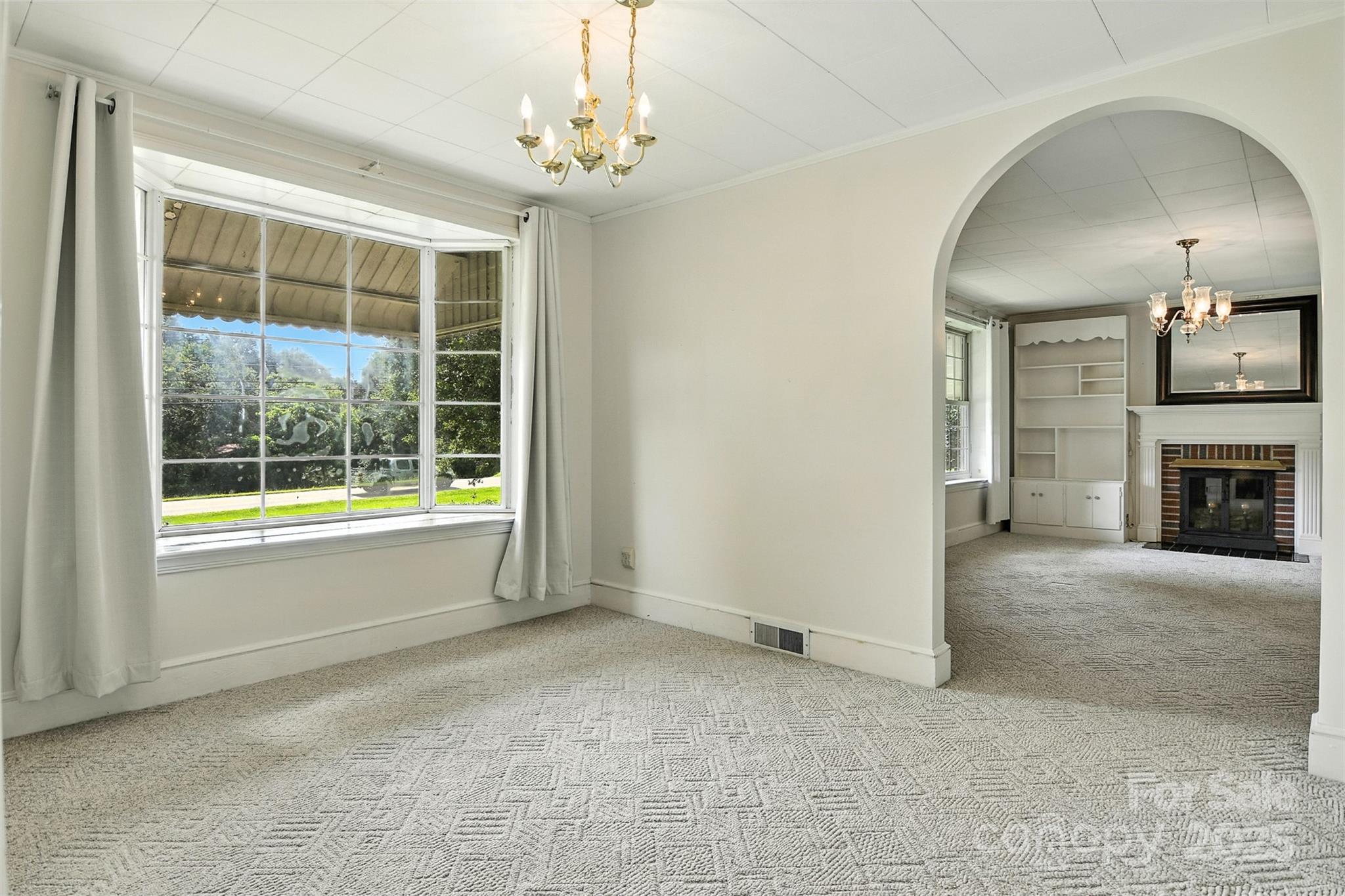3968 Highway 321 Hudson, NC 28638 - Photo 28 of 47 a view of livingroom with furniture chandelier and window