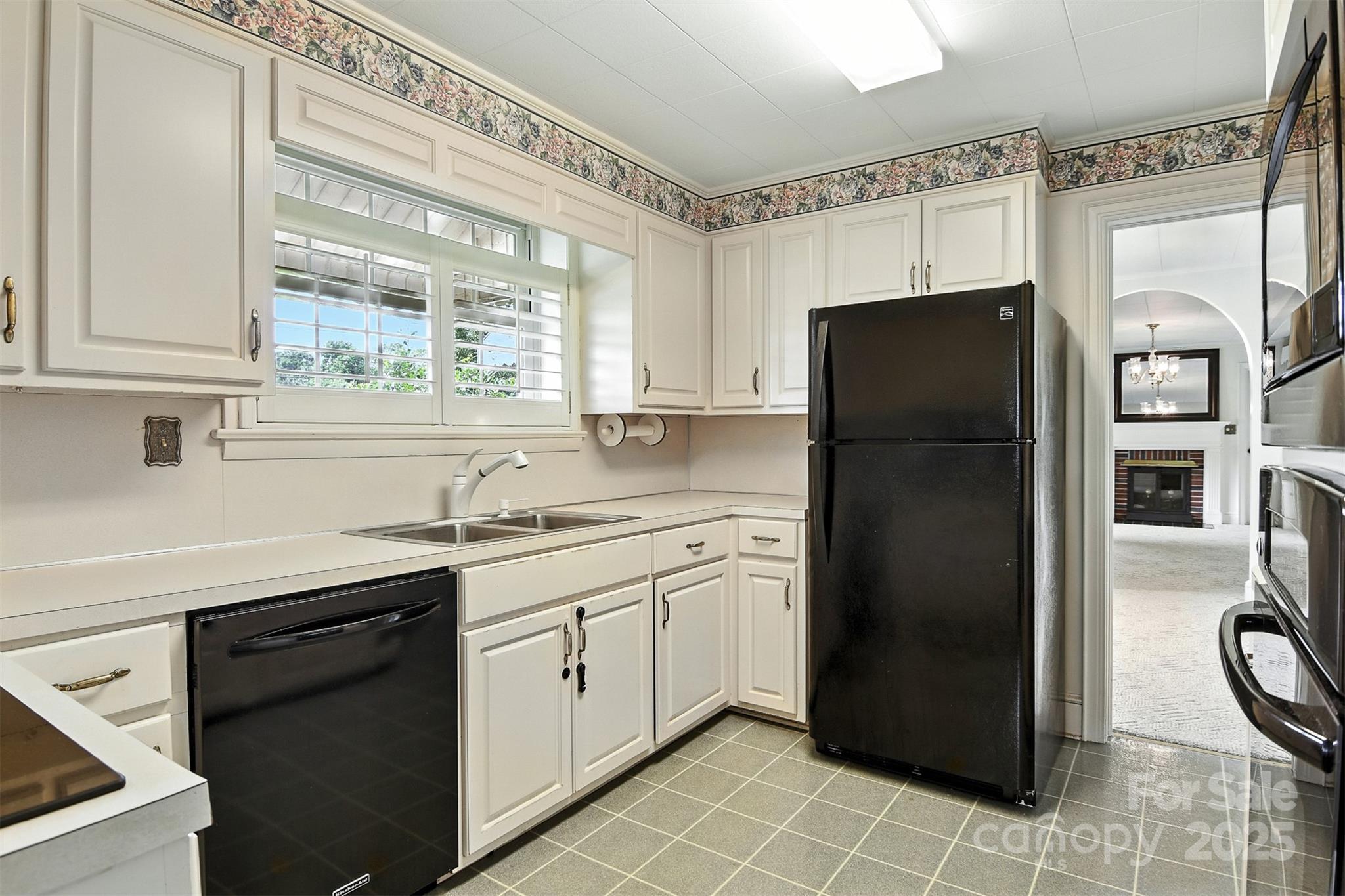 3968 Highway 321 Hudson, NC 28638 - Photo 5 of 47 a kitchen with a refrigerator sink and cabinets