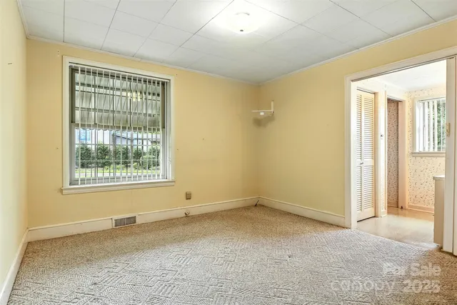 a view of an empty room with a window