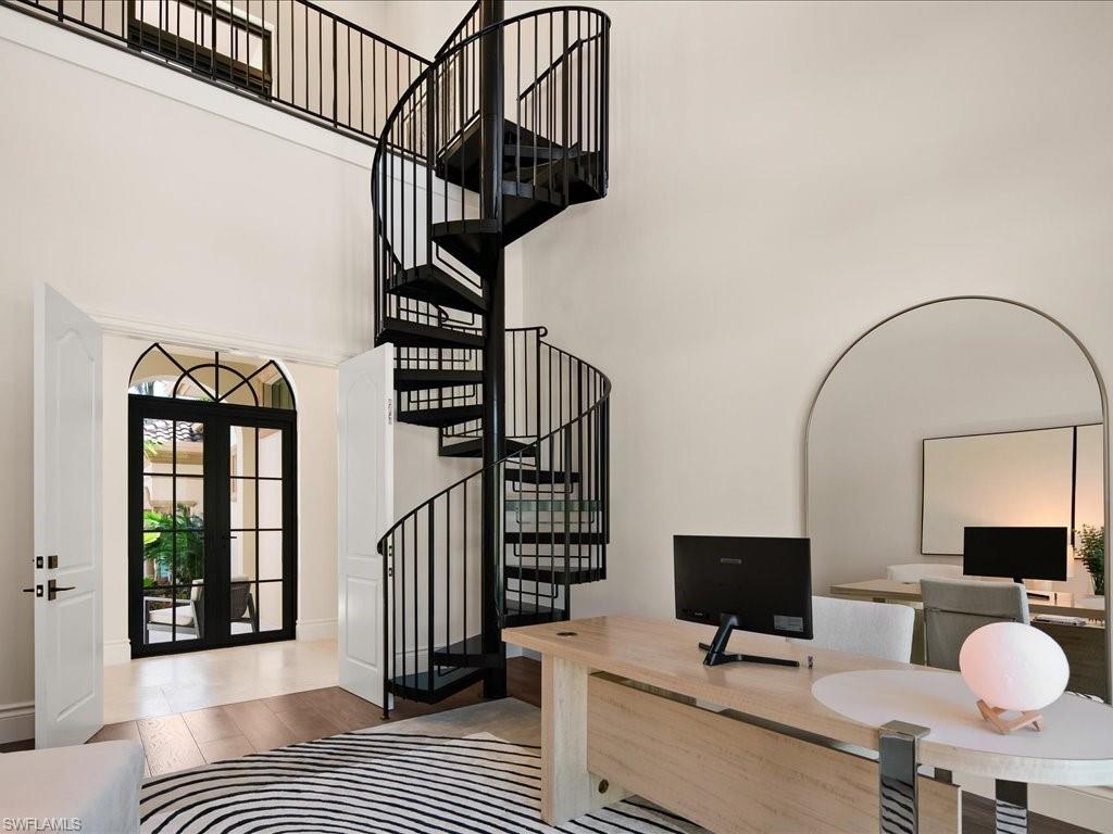 2581 Escada Drive Naples, FL 34109 - Photo 17 of 39 a view of entryway and hall with wooden floor