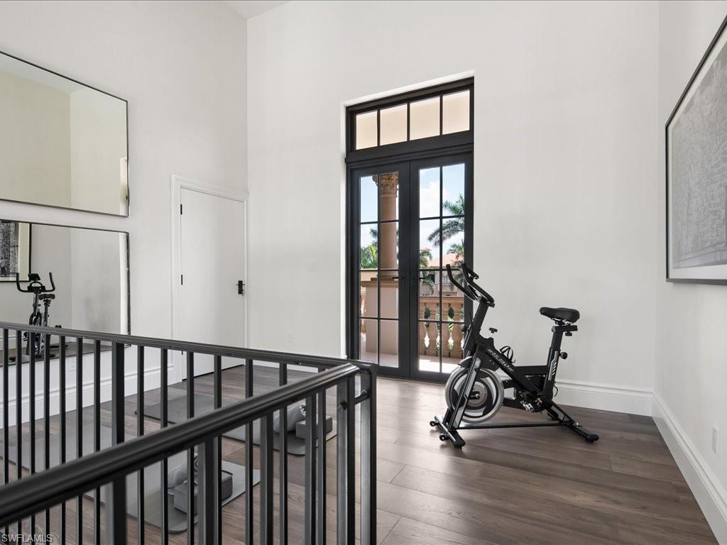2581 Escada Drive Naples, FL 34109 - Photo 18 of 39 a view of a room with gym equipment