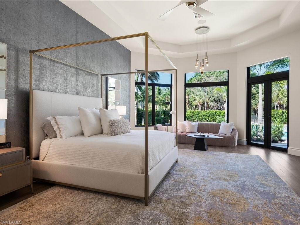 2581 Escada Drive Naples, FL 34109 - Photo 19 of 39 a living room with furniture and large windows